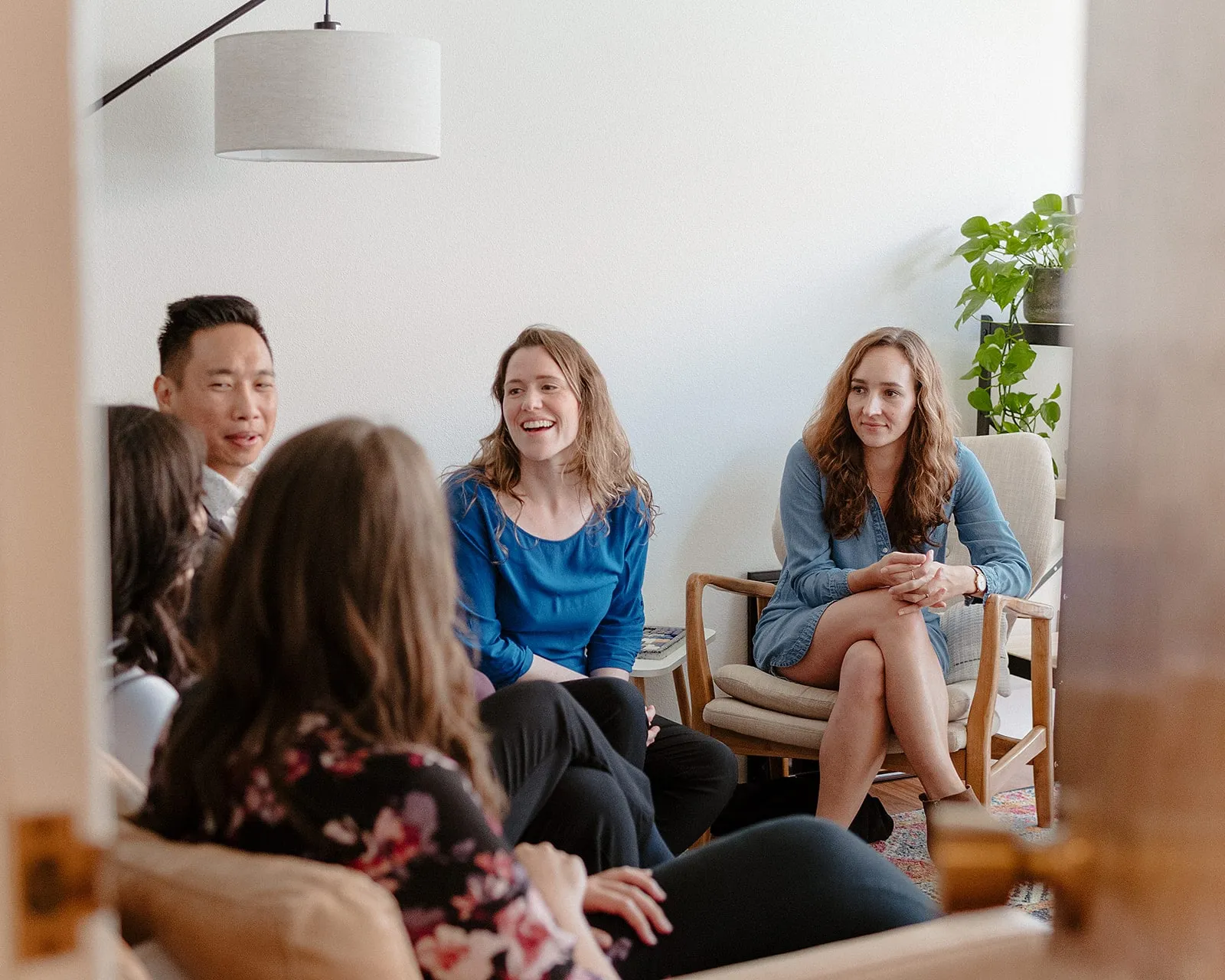 Child therapists at Coastal Therapy Group talking together in a warm North County San Diego office