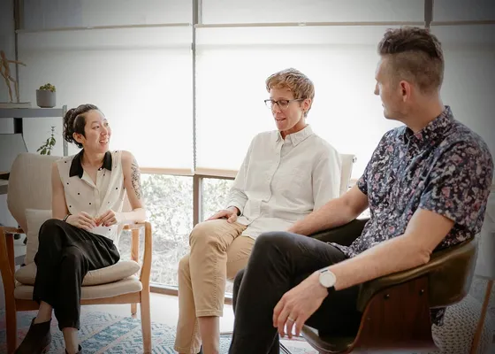 Adults sitting together in a group therapy session at Coastal Therapy Group in Vista, CA