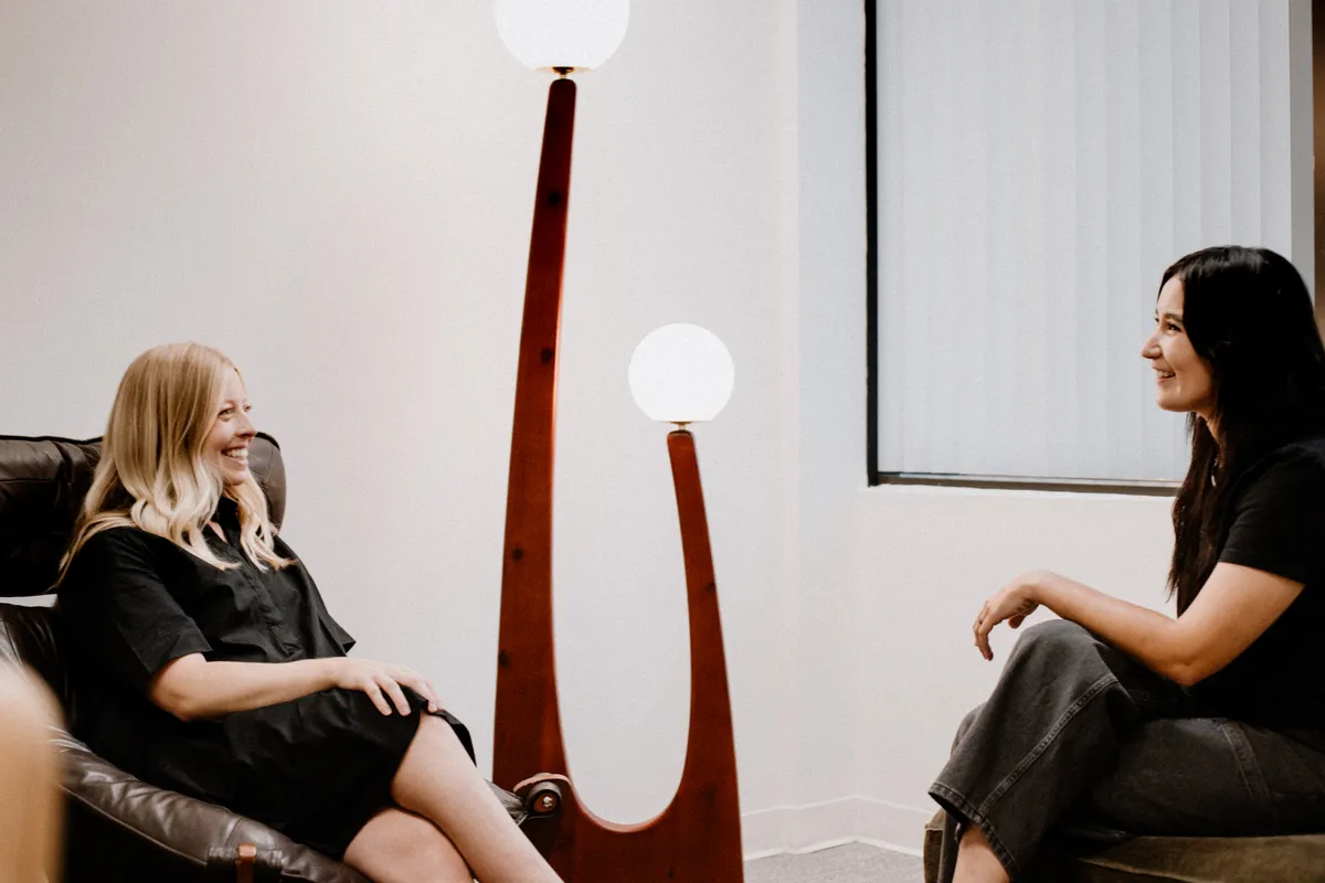 Two Coastal Therapy Group psychologists in conversation about a psychological evaluation